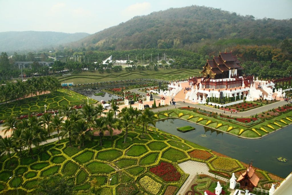 A photo of Chiang Mai showing a temple in the centre of various gardens and walkways.